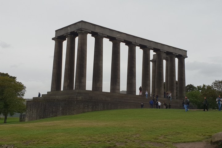 a building with a grassy field