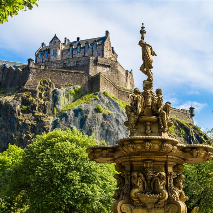 a castle with a clock at the top of a building