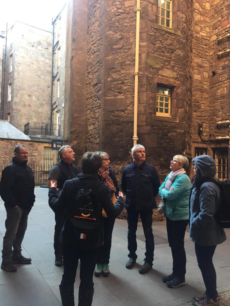 a group of people walking down the street