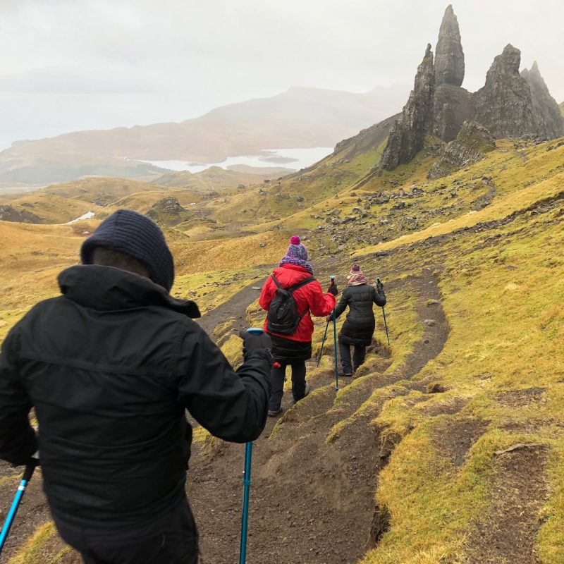 a man standing in front of a mountain