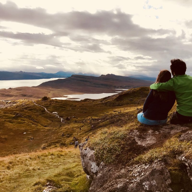a person standing on a rocky hill
