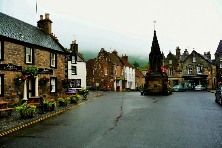 a clock on the side of a road
