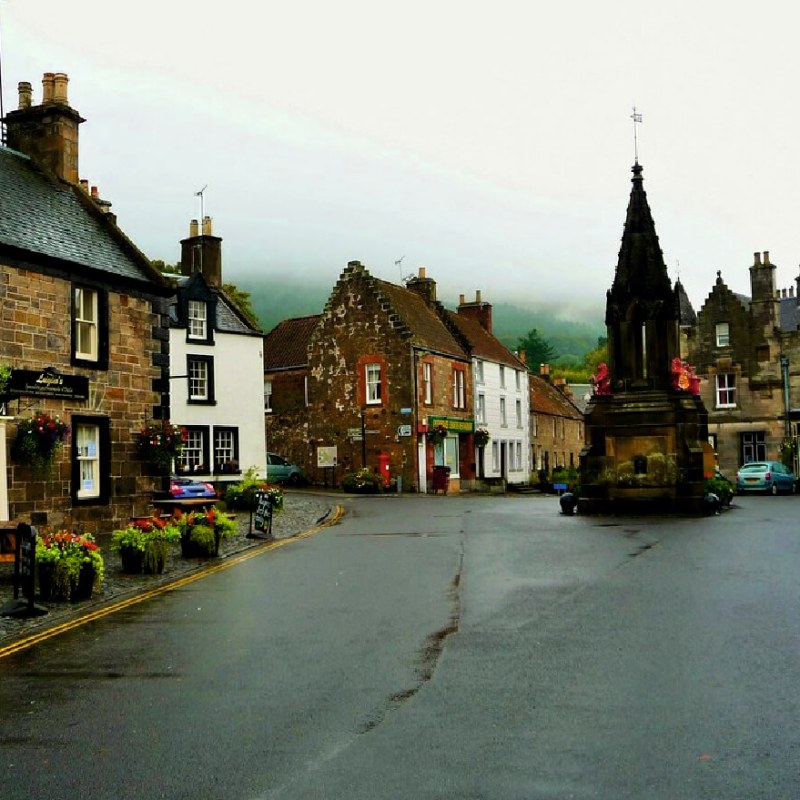 a clock on the side of a road